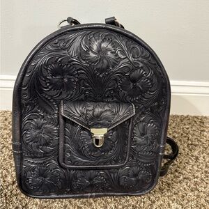 Black handmade tooled leather backpack. One of a kind.